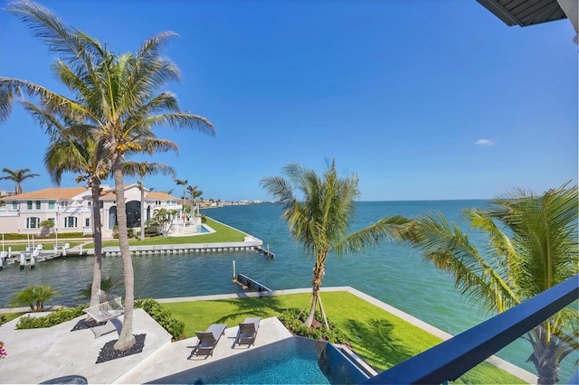 exterior space with a boat dock and a water view