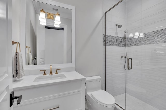 bathroom featuring a stall shower, vanity, toilet, and visible vents