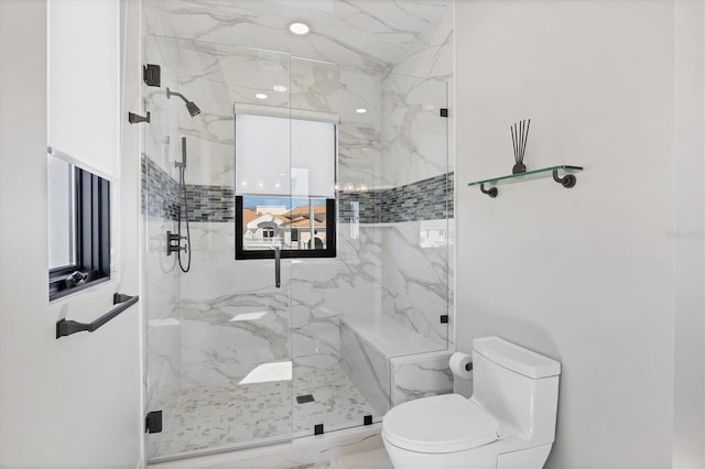 full bathroom featuring toilet, plenty of natural light, a marble finish shower, and marble finish floor