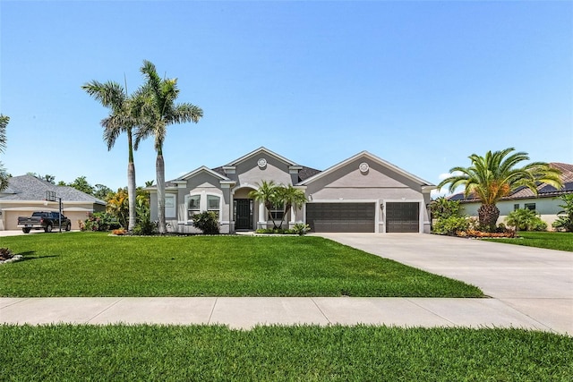 view of front of home with a garage, a front lawn, stucco siding, and driveway