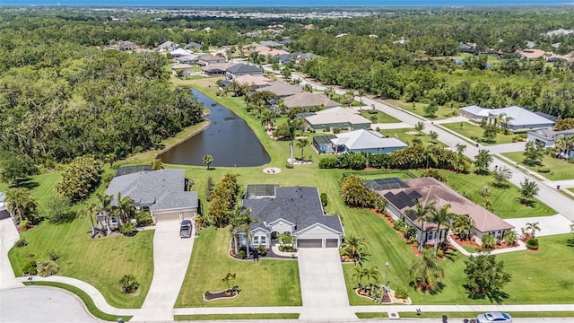 aerial view with a residential view and a water view