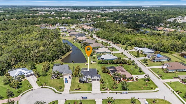 birds eye view of property featuring a water view and a residential view