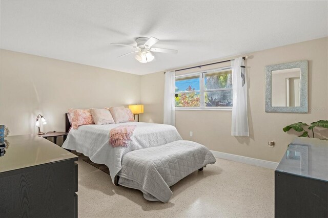 bedroom with baseboards and a ceiling fan