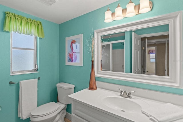bathroom with toilet, visible vents, a wealth of natural light, and a stall shower
