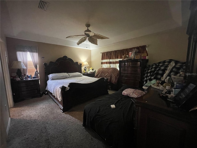 bedroom with ceiling fan, carpet, and visible vents