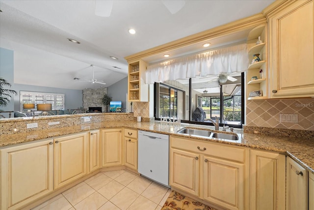 kitchen with white dishwasher, a ceiling fan, a sink, open shelves, and vaulted ceiling