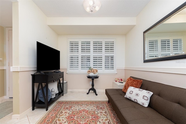tiled living room featuring baseboards