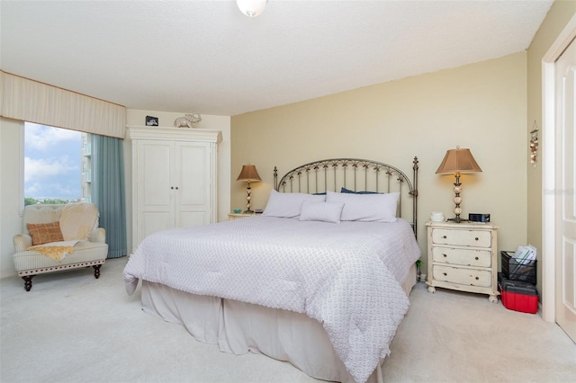 carpeted bedroom with a closet