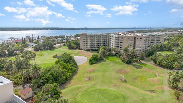 bird's eye view of apartment complex / building, a local golf course, and a large body of water