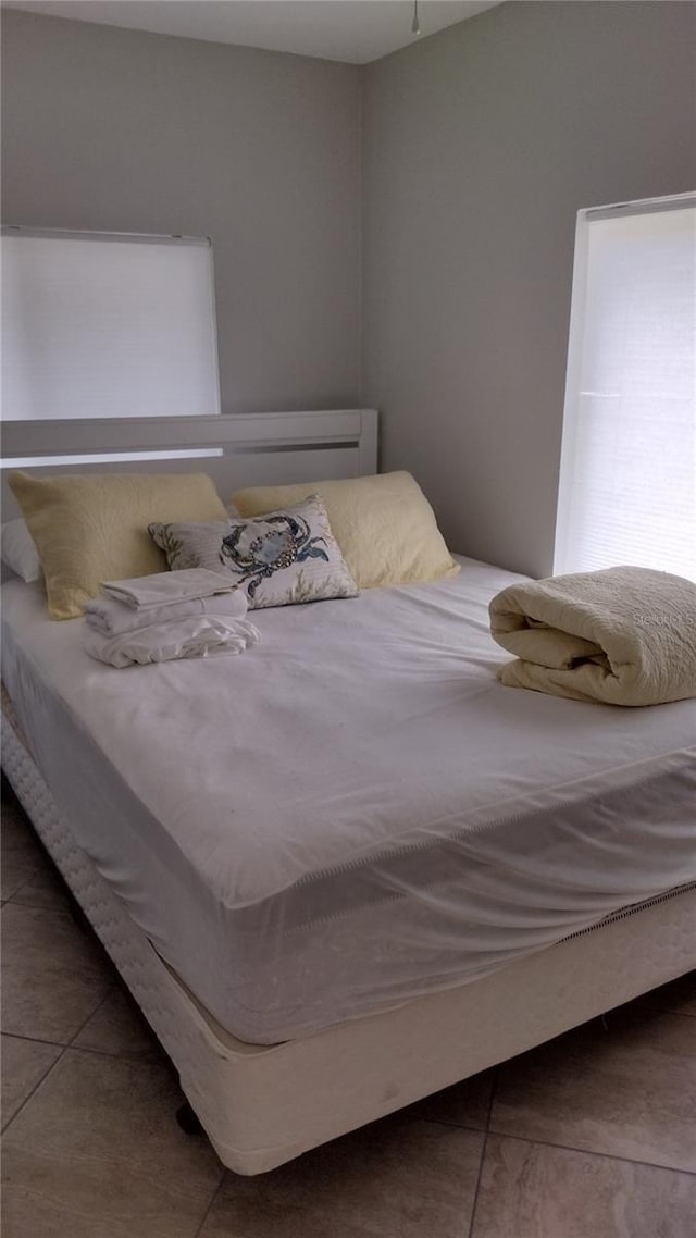bedroom featuring tile patterned flooring