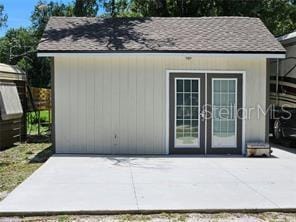 view of outbuilding featuring french doors