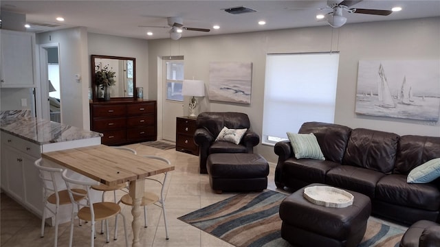 living room with ceiling fan, light tile patterned floors, visible vents, and recessed lighting