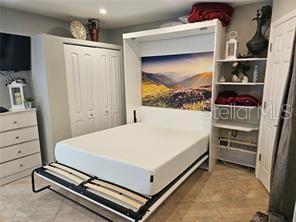 bedroom with a closet and recessed lighting