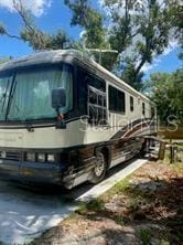 view of property exterior with a carport
