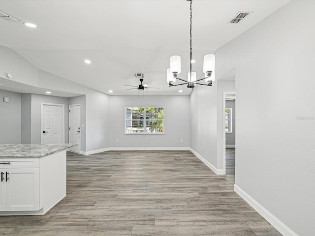 8304 Fishhawk Ave, New Port Richey, FL 34653 - unfurnished dining area featuring recessed lighting, baseboards, visible vents, and light wood finished floors