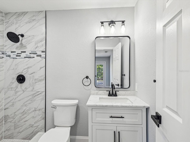 8304 Fishhawk Ave, New Port Richey, FL 34653 - bathroom featuring vanity, a textured wall, a tile shower, and toilet