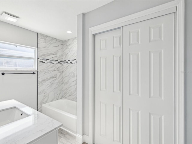 8304 Fishhawk Ave, New Port Richey, FL 34653 - full bathroom with vanity, marble finish floor, recessed lighting, bathing tub / shower combination, and visible vents
