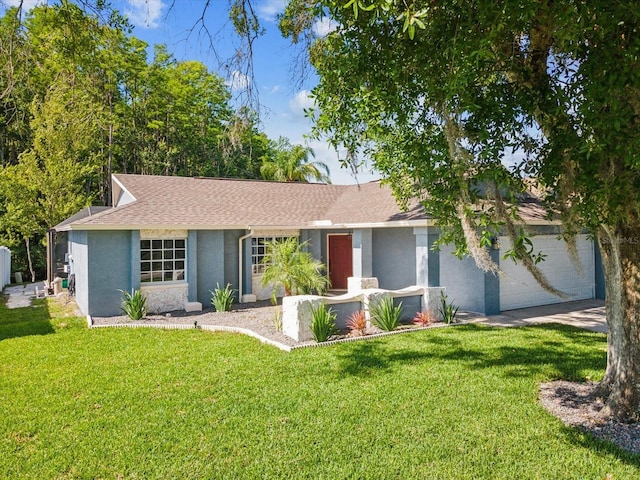 8304 Fishhawk Ave, New Port Richey, FL 34653 - ranch-style house featuring an attached garage, a front lawn, roof with shingles, and stucco siding