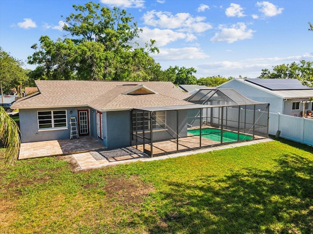 8304 Fishhawk Ave, New Port Richey, FL 34653 - back of property featuring a patio area, a fenced in pool, a fenced backyard, a yard, and a shingled roof