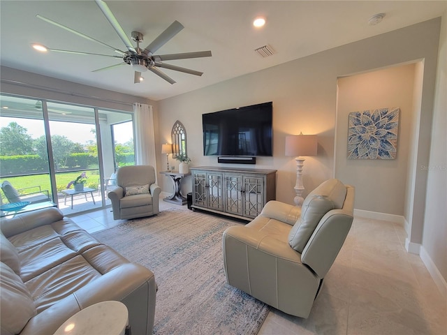26017 Seastone Dr, Englewood, FL 34223 - living room featuring tile patterned flooring, ceiling fan, baseboards, and recessed lighting