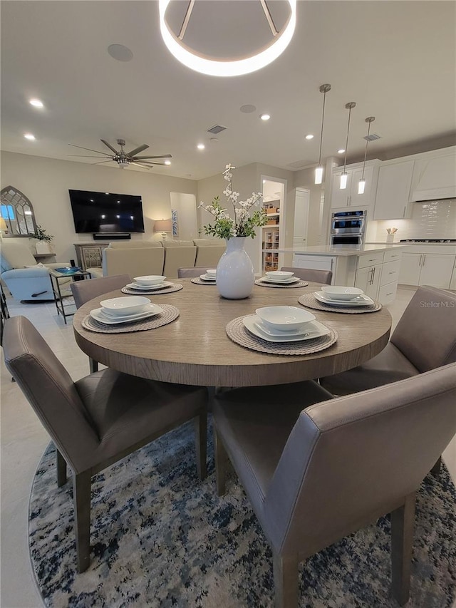 26017 Seastone Dr, Englewood, FL 34223 - dining space featuring ceiling fan and recessed lighting