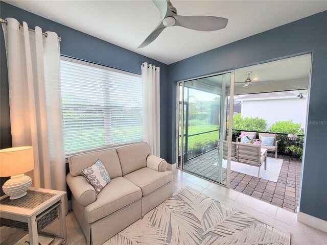 26017 Seastone Dr, Englewood, FL 34223 - living room featuring a ceiling fan and tile patterned flooring