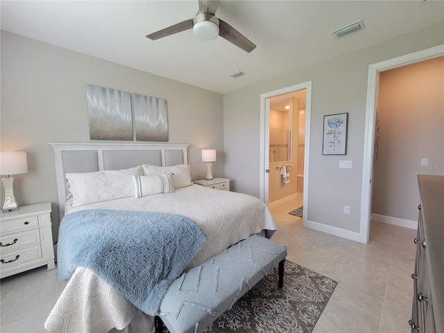 26017 Seastone Dr, Englewood, FL 34223 - bedroom featuring baseboards, ensuite bathroom, and a ceiling fan