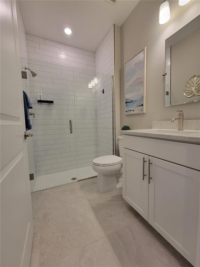 26017 Seastone Dr, Englewood, FL 34223 - bathroom with vanity, a shower stall, and toilet