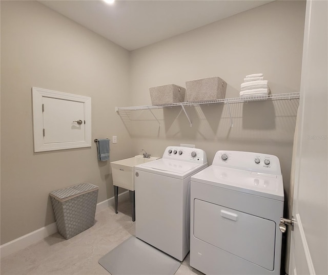 26017 Seastone Dr, Englewood, FL 34223 - washroom featuring washer and dryer and baseboards