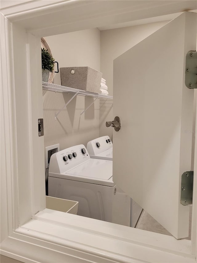 26017 Seastone Dr, Englewood, FL 34223 - laundry area with separate washer and dryer