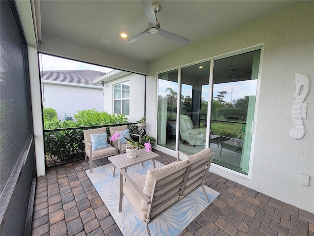 26017 Seastone Dr, Englewood, FL 34223 - sunroom featuring a ceiling fan, an outdoor hangout area, and plenty of natural light