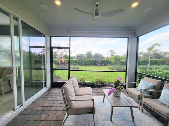 26017 Seastone Dr, Englewood, FL 34223 - sunroom / solarium with a ceiling fan and an outdoor living space