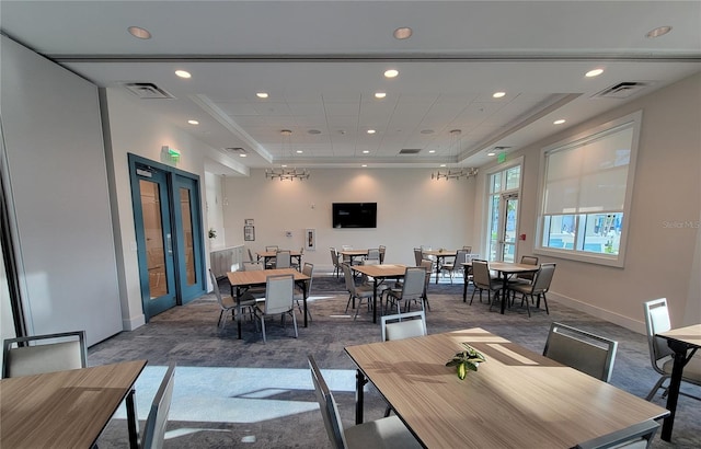 26017 Seastone Dr, Englewood, FL 34223 - dining room with a raised ceiling, recessed lighting, baseboards, and dark carpet