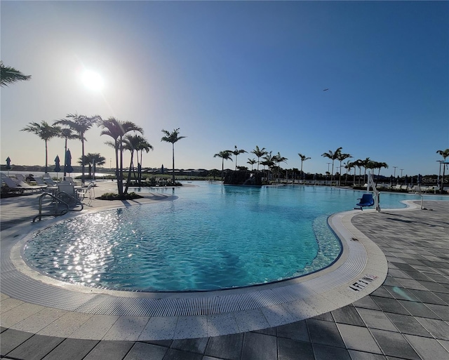 26017 Seastone Dr, Englewood, FL 34223 - community pool featuring a water view and a patio