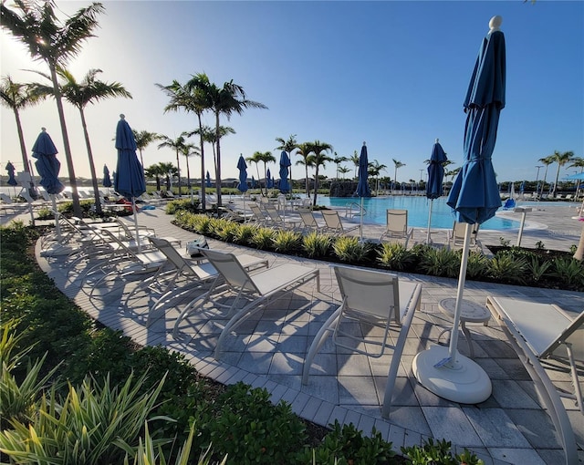 26017 Seastone Dr, Englewood, FL 34223 - view of home's community featuring a swimming pool and a patio area