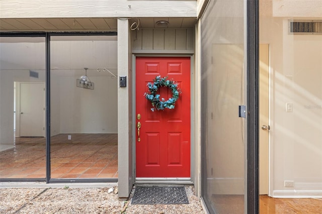 view of exterior entry with visible vents