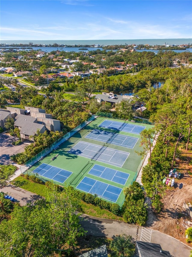 birds eye view of property with a water view and a residential view