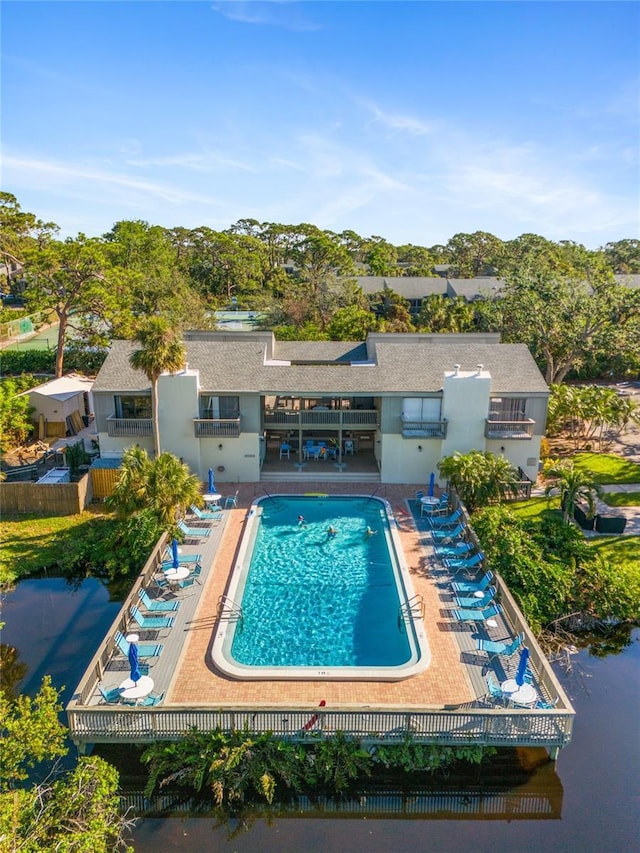 pool featuring a patio and fence