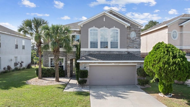 view of front facade featuring a garage, a front lawn, stone siding, and concrete driveway