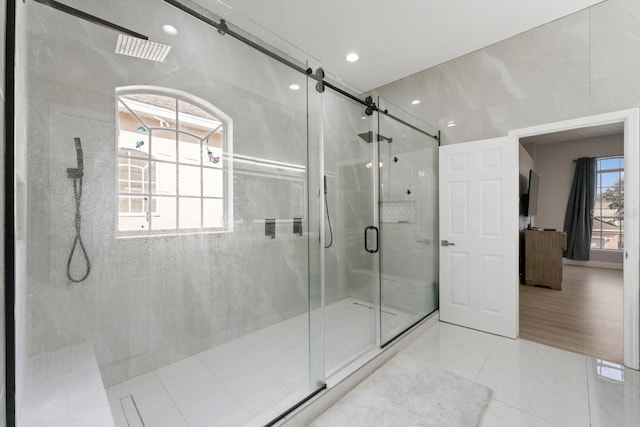 bathroom featuring recessed lighting and a stall shower