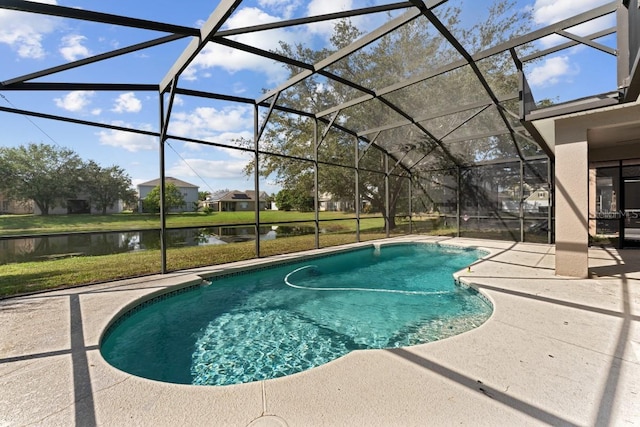 outdoor pool with a yard, a water view, a patio area, and glass enclosure