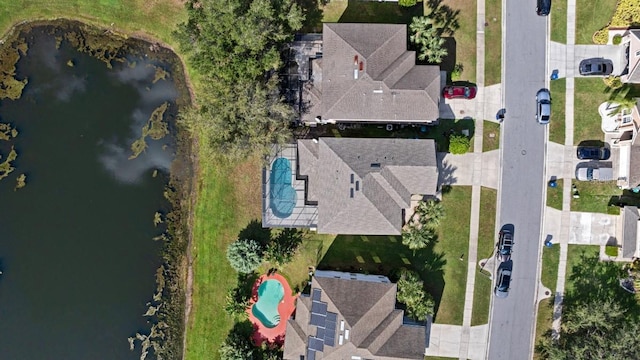 birds eye view of property featuring a water view and a residential view