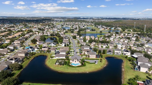 bird's eye view featuring a residential view and a water view