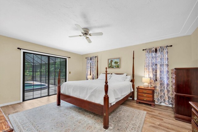 bedroom featuring light wood-style floors, baseboards, a ceiling fan, and access to exterior