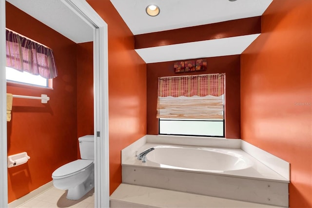 full bathroom featuring toilet, tile patterned flooring, and a bath