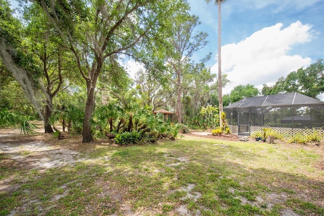 view of yard featuring a lanai