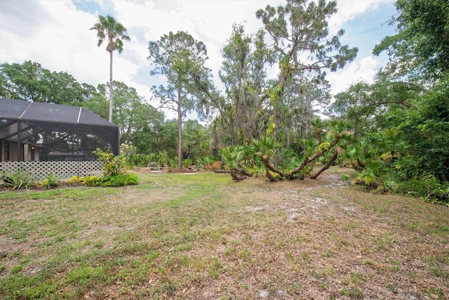 view of yard with a lanai