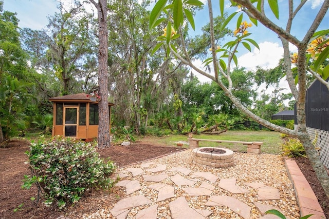 view of patio with a fire pit