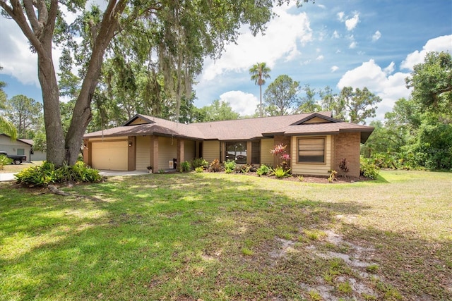 ranch-style house with a garage and a front lawn