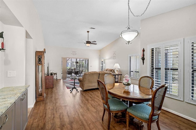 7817 Pine Trace Dr Unit 15, Sarasota, FL 34243 - dining room with a healthy amount of sunlight, a ceiling fan, vaulted ceiling, and dark wood finished floors